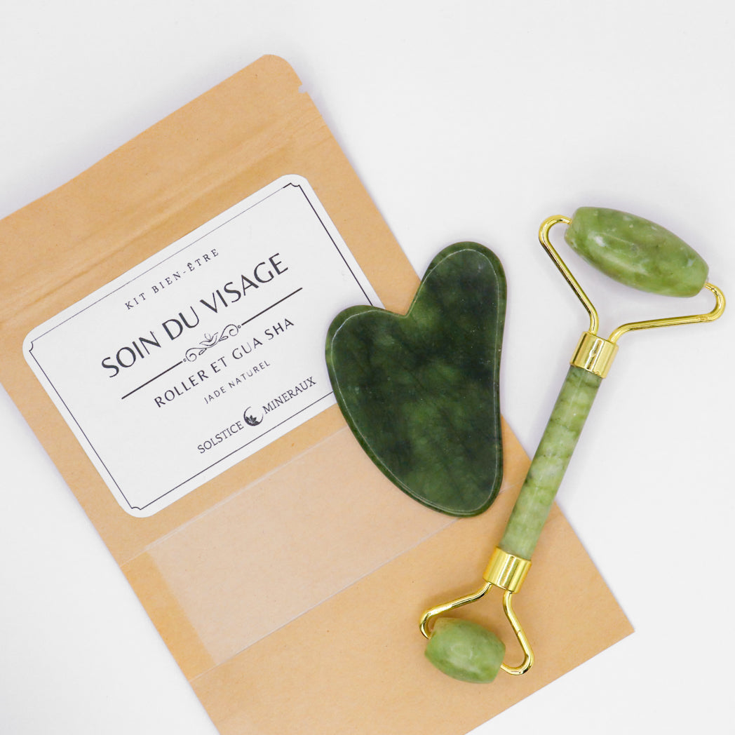 Coffret de soin de lithothérapie comprenant un rouleau de massage facial et une pierre Gua Sha en véritable jade vert naturel.